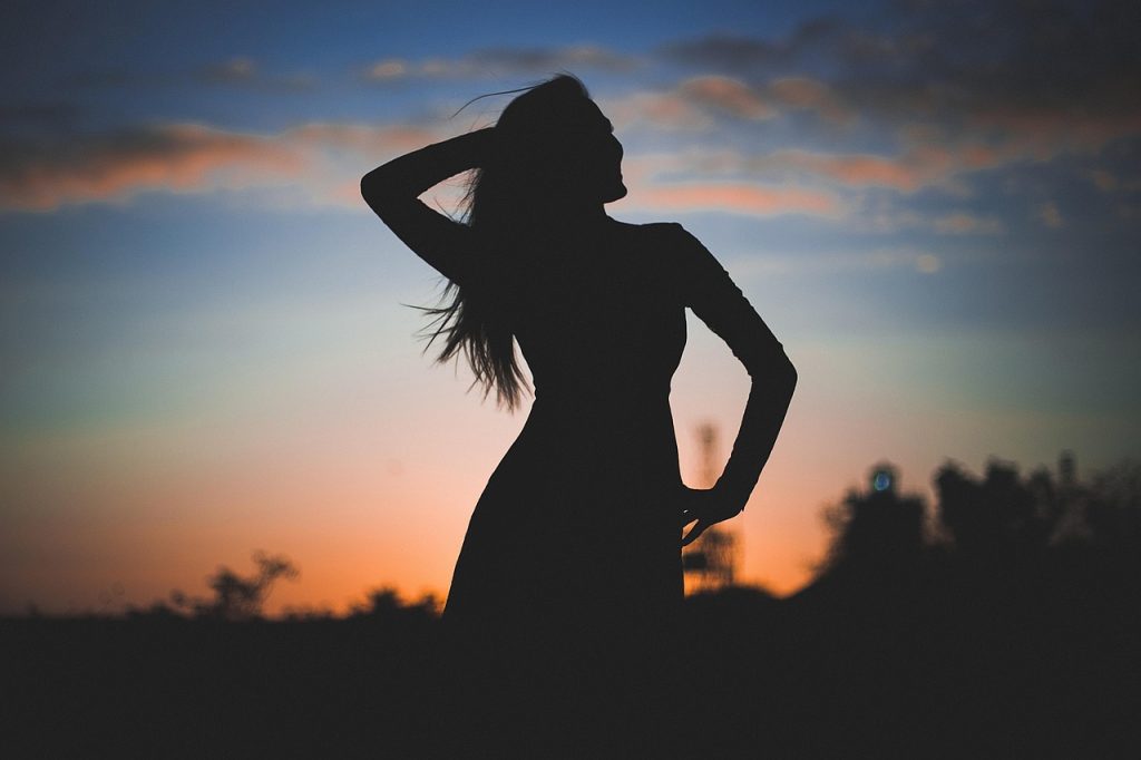 self-confident woman sunset